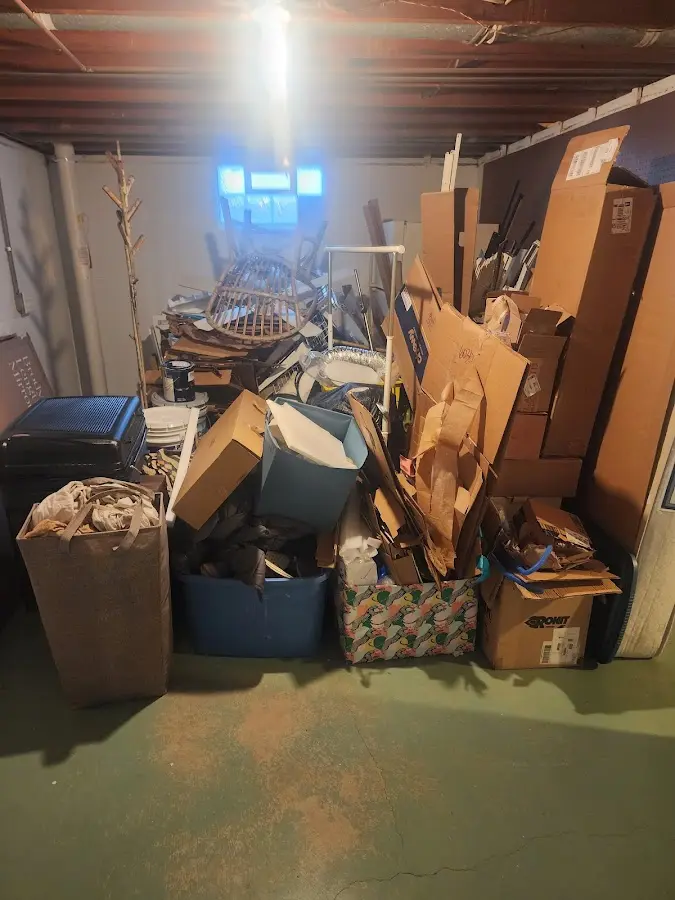 Roll-off dumpster container at job site for 2 Yard Dumpster Rental in Lapeer